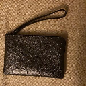 Metallic dark gray coach wristlet